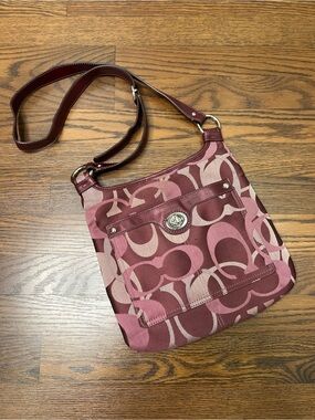 Coach Penelope Optic Signature Hippie Crossbody Bag in a purple/plum color